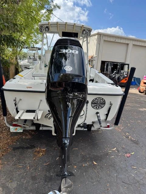 White fishing boat with Suzuki 300hp repower