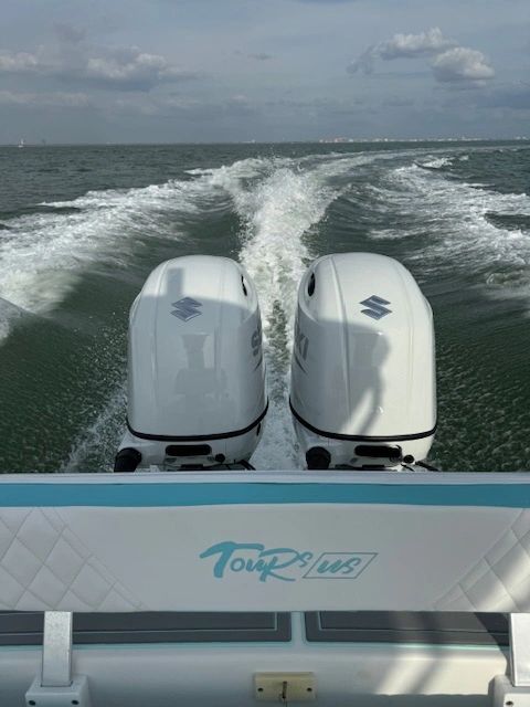 Boat with twin Suzuki outboard motors on ocean