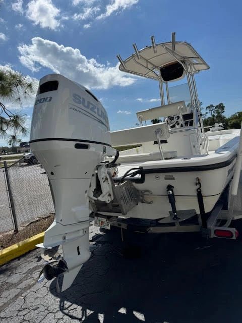White boat with Suzuki 200 outboard motor